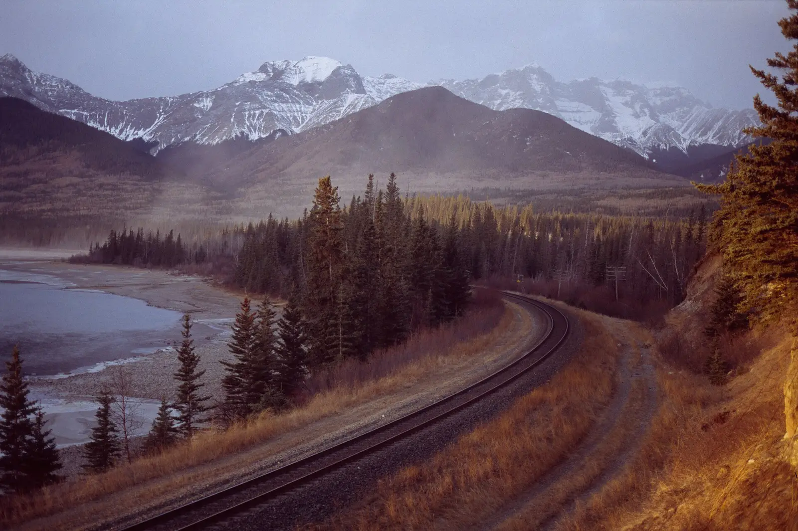 The Athabasca River railroad track at the mouth of Brûlé Lake in Alberta, Canada.